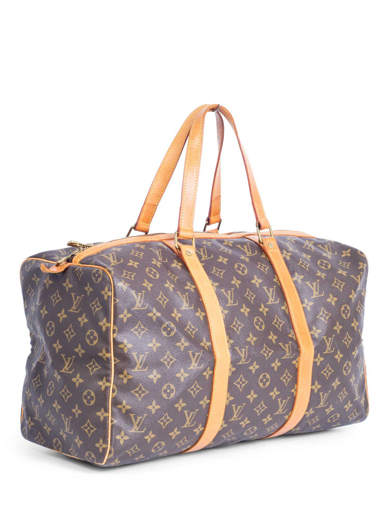 SOLD. Louis Vuitton: A vintage Keepall 55 travel bag of brown